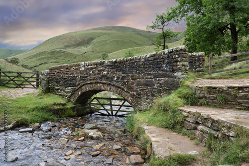 Footbridge at the foot of Jacob's Ladder on the Pennine Way: a brisk walk from Edale this section is a popular walk for day walkers due to good transport and rail links. photo