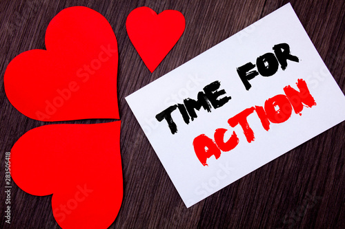 Writing text showing Time For Action. Concept meaning Success Goal Fulfilment Deadline written on notobook paper note on wooden background with Love Heart. photo