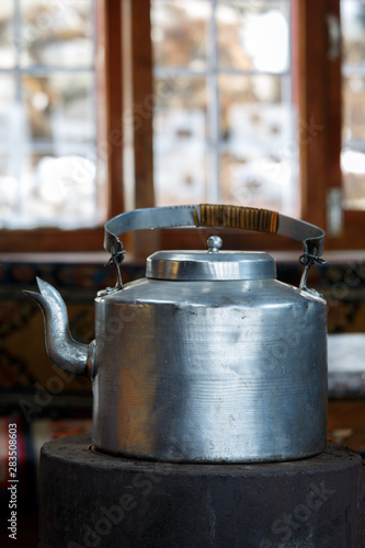 Kettle with hot water on the stove in a Nepal lodge. Everest hiking and trekking