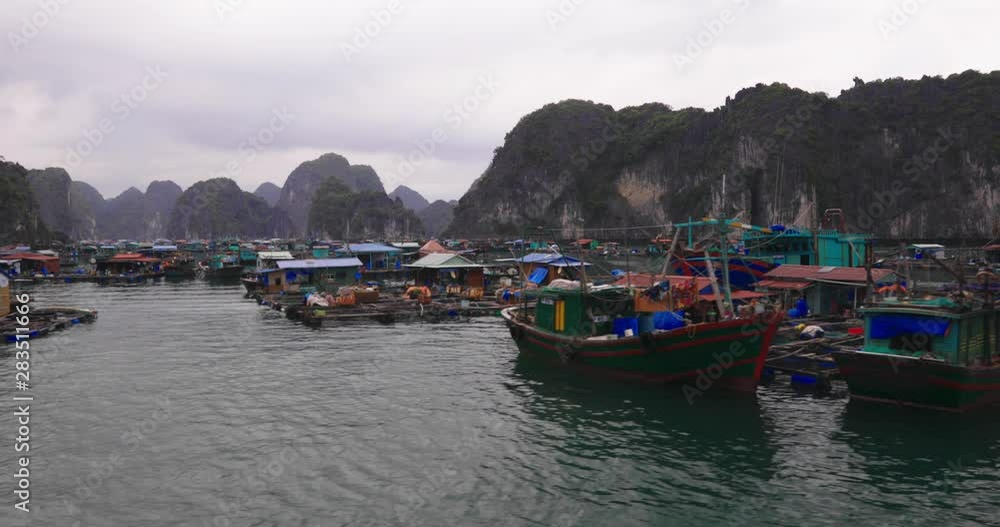 Boat trip through Halong Bay, Vietnam - floating village - UNESCO World Heritage Site Boat trip through Halong Bay, Vietnam - floating village - UNESCO World Heritage Site