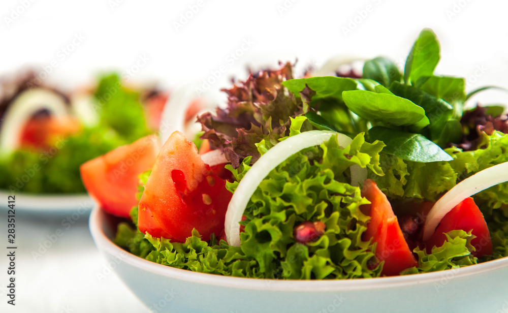 Summer salad with green lettuce and tomatoes Summer salad with green lettuce and tomatoes