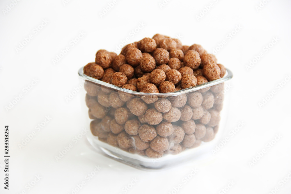 sweet corn chocolate balls in a glass plate on a white background sweet corn chocolate balls in a glass plate on a white background
