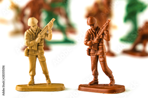 army of toy soldiers isolated white background.