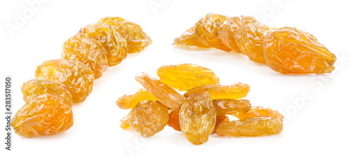 Yellow raisins isolated on white background