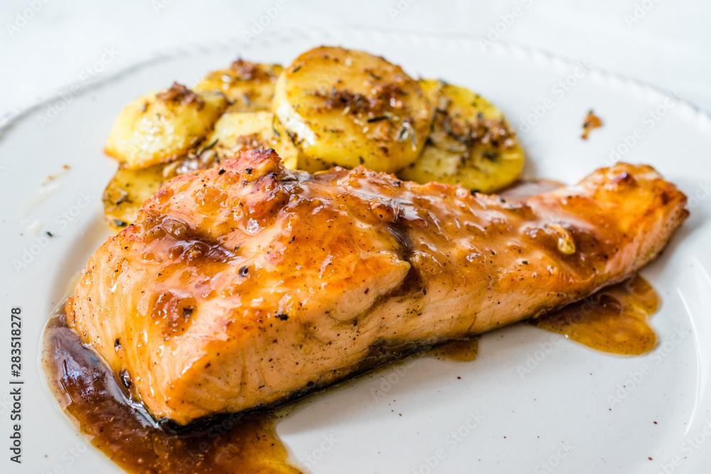 Grilled Salmon with Honey Glaze, Burnt Butter and Baked Potatoes. Grilled Salmon with Honey Glaze, Burnt Butter and Baked Potatoes.