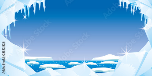 Ice with icicles and snow on a blue background.