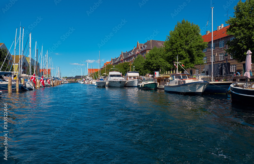 Canal with boats, ships and yachts in Copenhagen