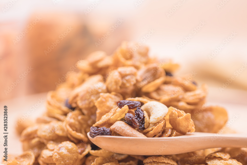 Delicious cereal caramel cornflakes warm tone background. A Breakfast cereal made by flakes of corn. Delicious cereal caramel cornflakes warm tone background. A Breakfast cereal made by flakes of corn.