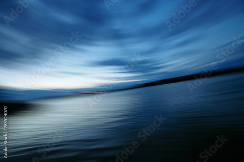 blurred sky and lake at long exposure © Andrii