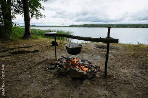 cooking soup on fire in nature