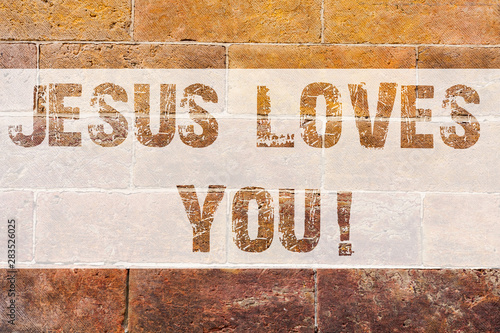 Text sign showing Jesus Loves You. Conceptual photo Believe in the Lord To have faith religious demonstrating Brick Wall art like Graffiti motivational call written on the wall