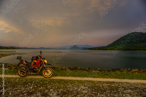 Purwakarta, West Java, Indonesia (03/30/2018) : The rider is touring with his motorcycle through the Jatiluhur Dam side which is commonly called Parang Gombong