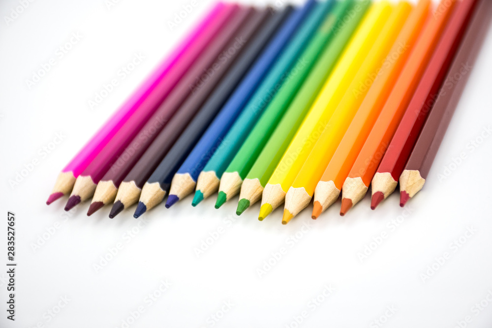 Rainbow color pencils on white background. Back to school. Empty space for text input