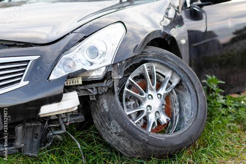 Car in road accident. Close-up of wheel and headlights. © Andrii Zastrozhnov