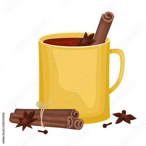 Red mulled wine in a yellow Cup with cinnamon sticks, cloves and a tub. Winter alcoholic drink.