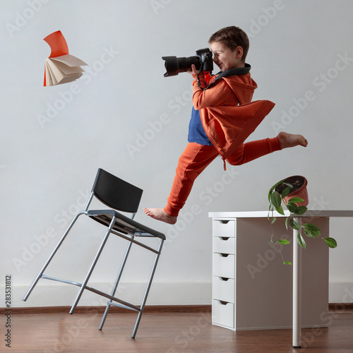 Young photographer. A child with a camera in his hands. Collage