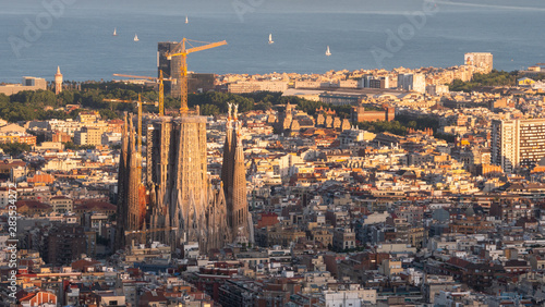 Panorama of Barcelona Spain, viewed from the Bunkers of Carmel on sunset. Aerial top view from hill with sagrada familia cathedral.