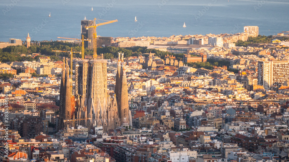 Panorama of Barcelona Spain, viewed from the Bunkers of Carmel on sunset. Aerial top view from hill with sagrada familia cathedral.