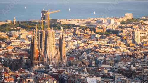 Panorama of Barcelona Spain  viewed from the Bunkers of Carmel on sunset. Aerial top view from hill with sagrada familia cathedral.