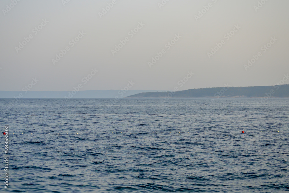 Obraz premium Sunset on Adriatic sea in Brela, Croatia 