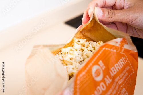 Opening a microwave popcorn bag