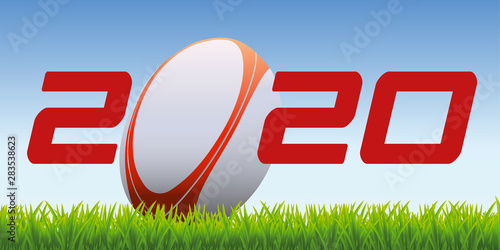 The year 2020 symbolizes the world of rugby with an oval ball placed on the lawn of a field