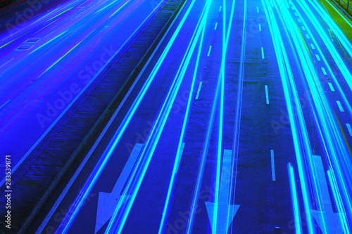 Vehicle light trails on road