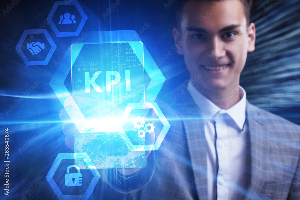 The concept of business, technology, the Internet and the network. A young entrepreneur working on a virtual screen of the future and sees the inscription: KPI The concept of business, technology, the Internet and the network. A young entrepreneur working on a virtual screen of the future and sees the inscription: KPI