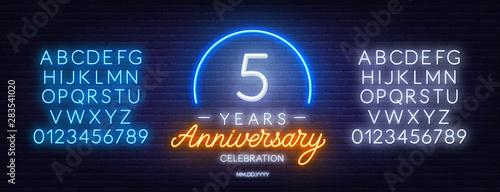 5th anniversary celebration neon sign on dark background. Neon alphabet . Template for invitation or greeting card.