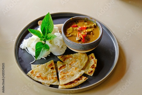 Thai Green Curry with Beef with Fermented rice noodles and roti.