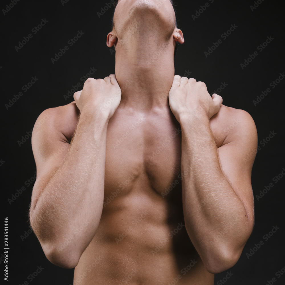 Crop man massaging neck and shoulders Crop man massaging neck and shoulders