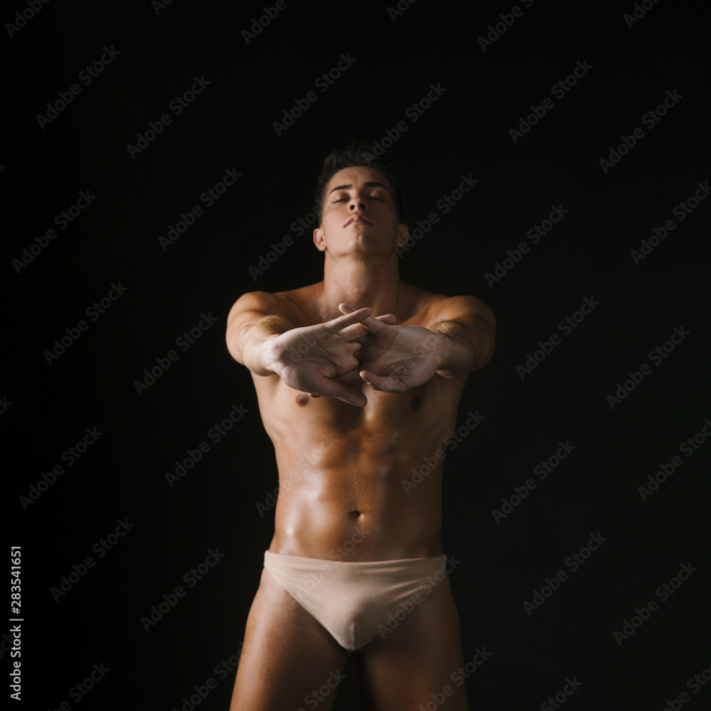 Fototapeta premium Strong guy stretching arms