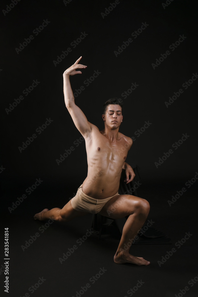 Man stretching leaning on knee raising hands Man stretching leaning on knee raising hands