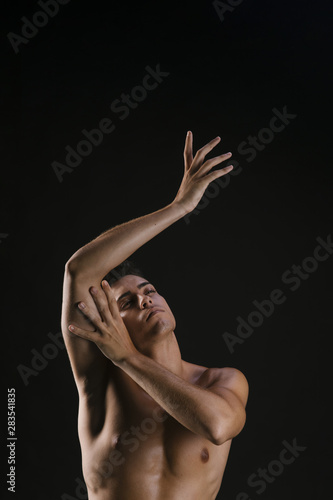 Man looking up and gently pulling hands