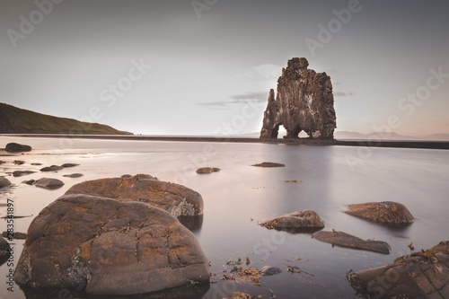 Hvítserkur. Iceland. person standing next to Hvítserkur. north iceland photo