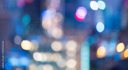 Light abstract blurred bokeh from the big city at night for background.