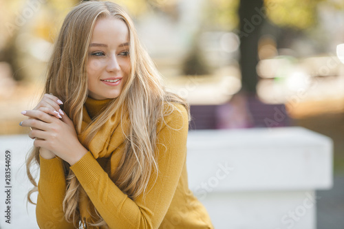 Closeup portrait of young beautiful woman. Female outdoors.