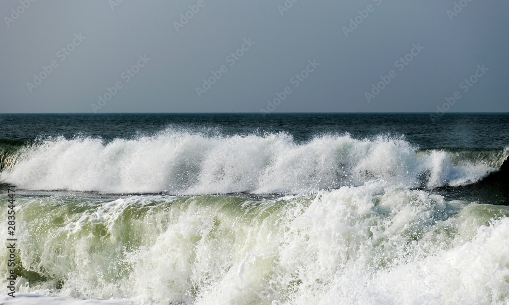 landscape with waves ashore with horizon and gray sky landscape with waves ashore with horizon and gray sky