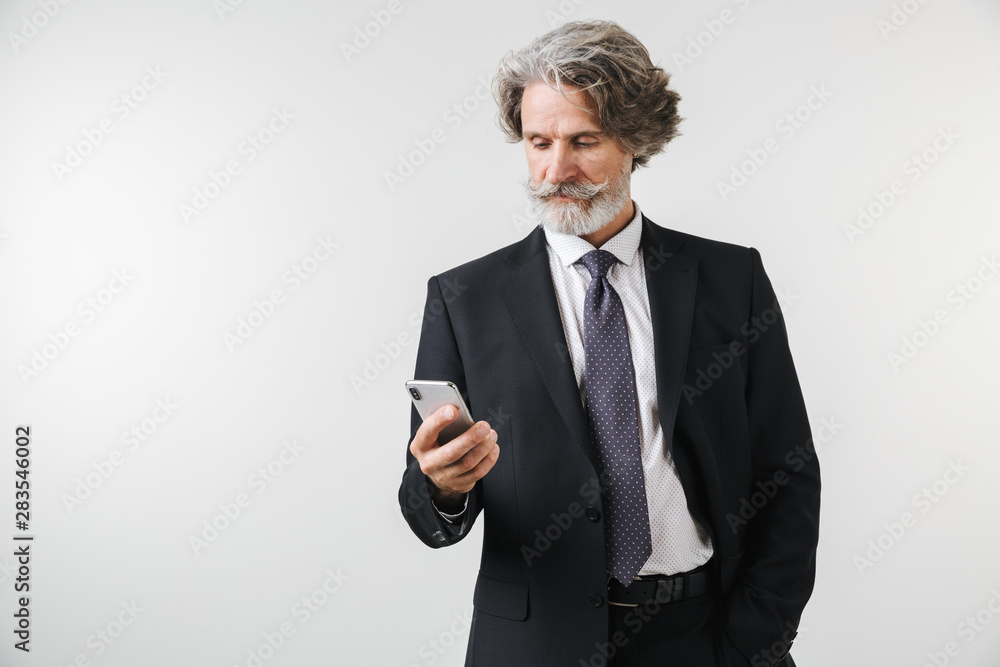 Smiling confident mature businessman wearing suit Smiling confident mature businessman wearing suit