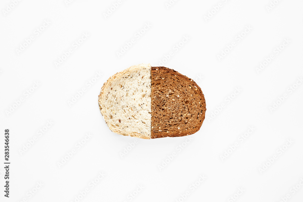 A slice from halves of fresh and rye bread isolated on white.