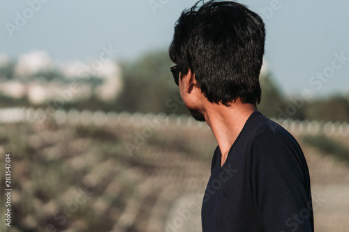 portrait of young man looking sideways