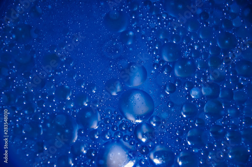Abstract bubbles blue bokeh background