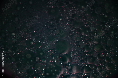 Abstract bubbles dark bokeh background