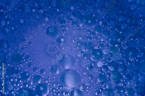 Abstract bubbles blue bokeh background