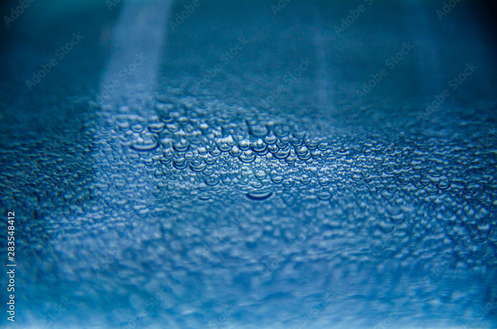 Abstract background of blue water bubbles close up