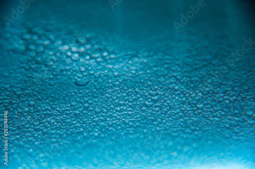 Abstract background of blue water bubbles close up