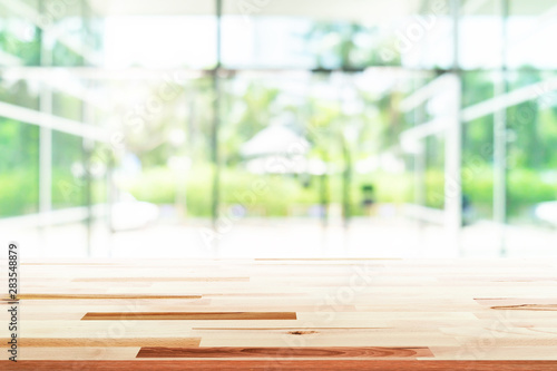 Wood flooring with glass office. atmosphere around office  blur background with bokeh. © Akura Yochi
