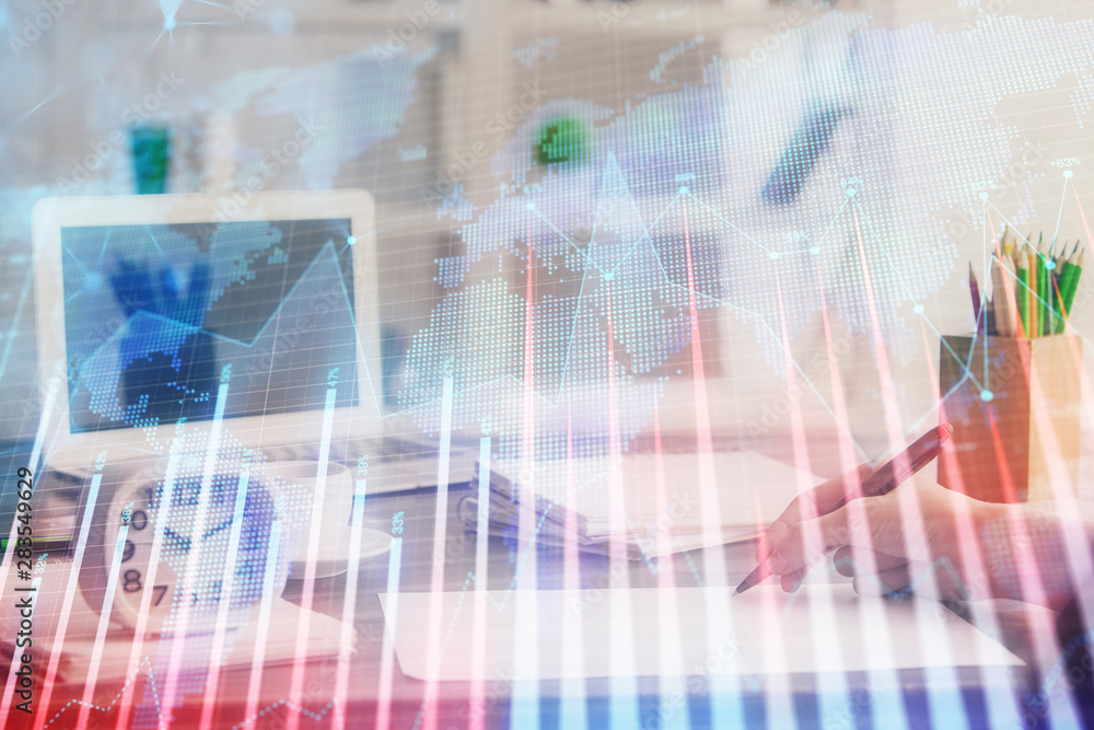 Financial graph displayed on woman's hand taking notes background. Concept of research. Multi exposure Financial graph displayed on woman's hand taking notes background. Concept of research. Multi exposure