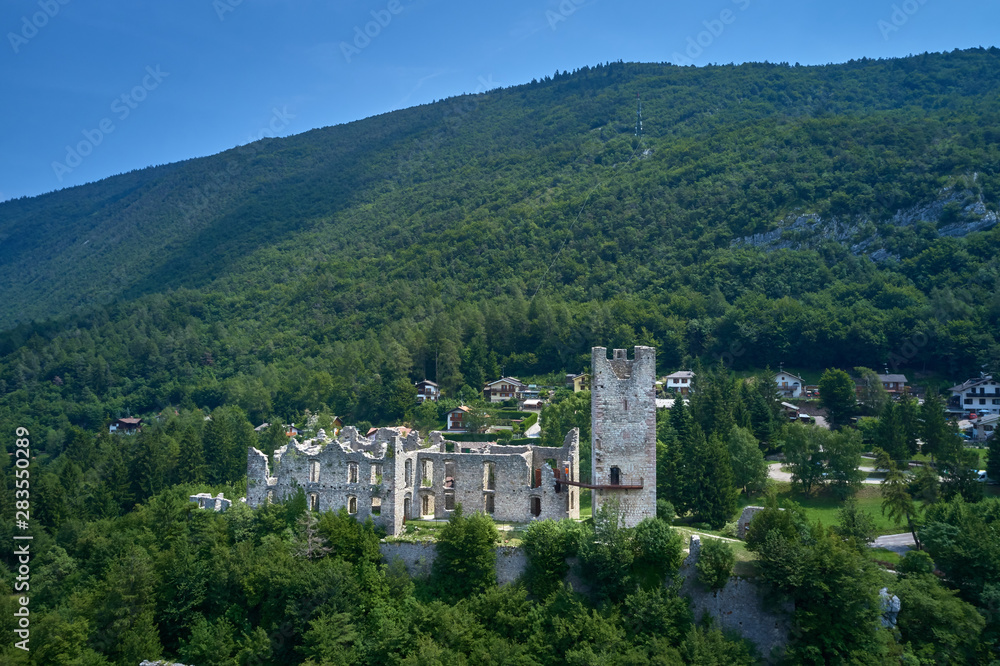 Panoramic view of the Castel Belfort region of Trento north of Italy. The ruins of the castle surrounded by nature. Aerial view.