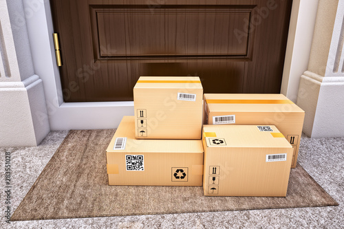Internet shopping, online purchases, e-commerce and express package door-to-door delivery service concept, cardboard boxes on the door mat near the entrance door